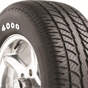 Angled view of Hercules H/P 4000 295/50R15 performance touring tire showing solid center rib and balanced tread blocks for stability.