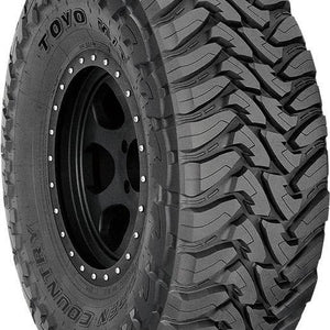 Full side view of Toyo Open Country M/T 295/65R20 LT P mud-terrain light truck tire with bold sidewall lettering on white background