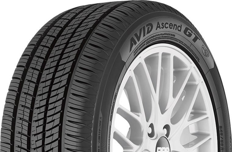 Angled view of Yokohama Avid Ascend GT 215/60R16 grand touring all-season tire showing balanced tread blocks and performance shoulder design.